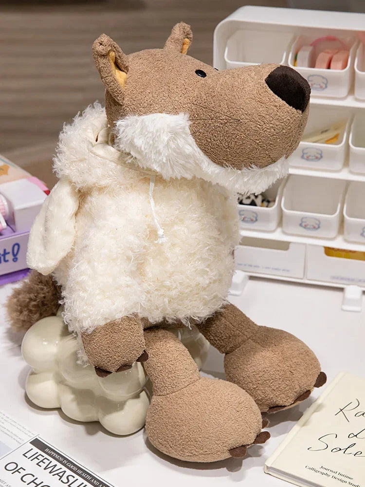 A soft brown plush toy resembling a wolf in sheep's clothing, featuring light cream fur and white accents.