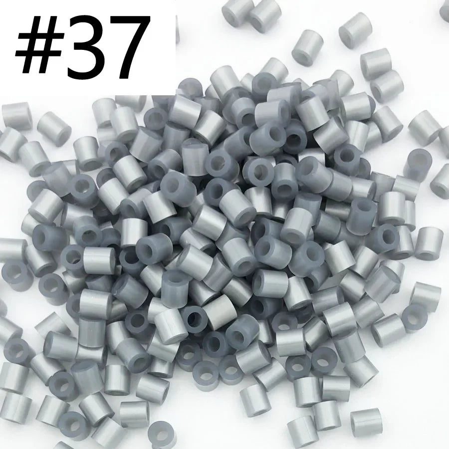A pile of 1000 assorted 5mm fuse beads in various colors for creative craft projects.