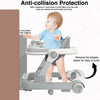 A baby is using a gray toddler push walker with a feeding tray for safe exploration.