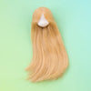 A long, straight blonde hair wig displayed against a light green background.