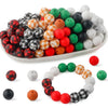 A bowl filled with various colored silicone beads including red, green, black, white, and orange for crafts and jewelry makin