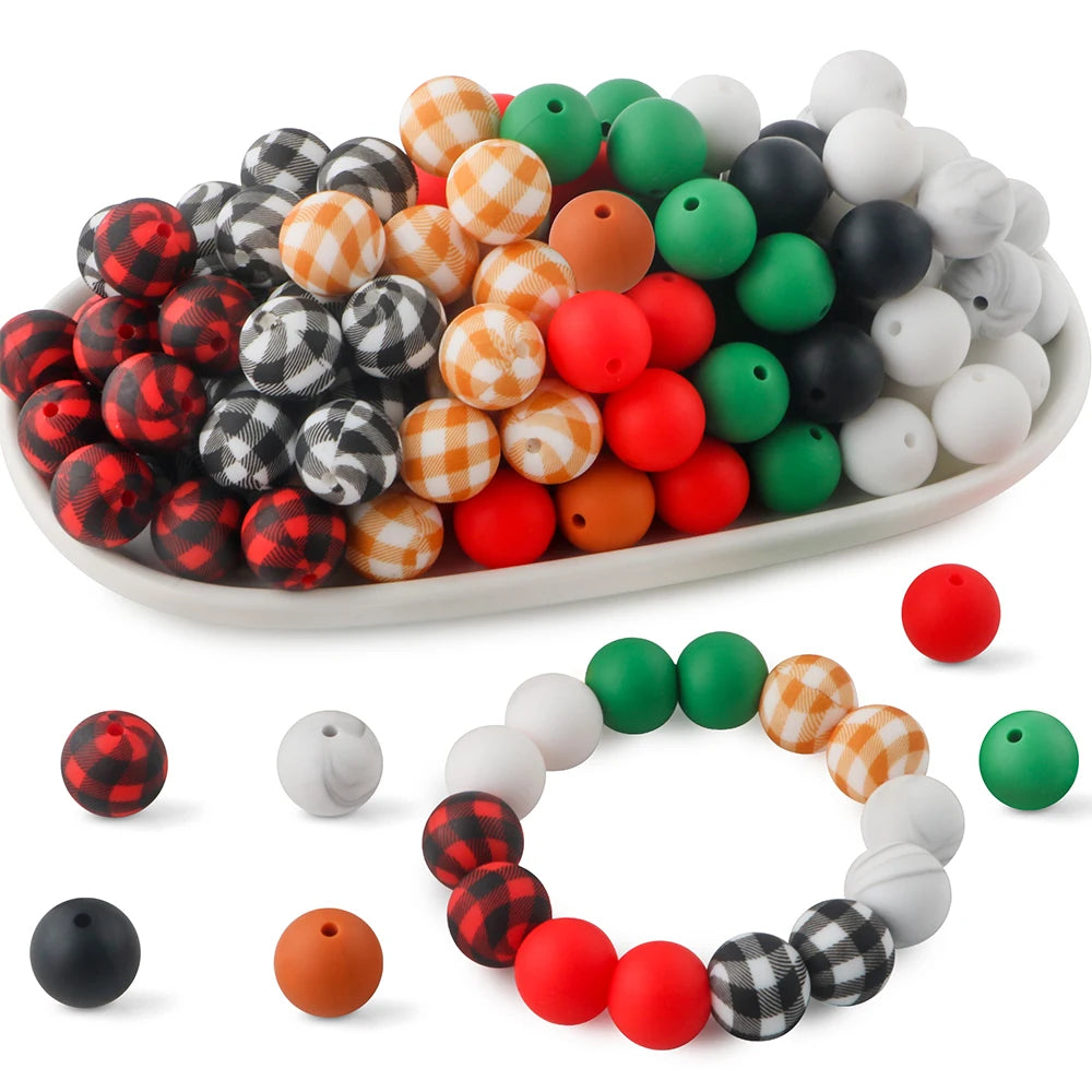 A bowl filled with various colored silicone beads including red, green, black, white, and orange for crafts and jewelry makin