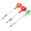 Three beadable badge reels with retractable clips in orange, red, and green colors