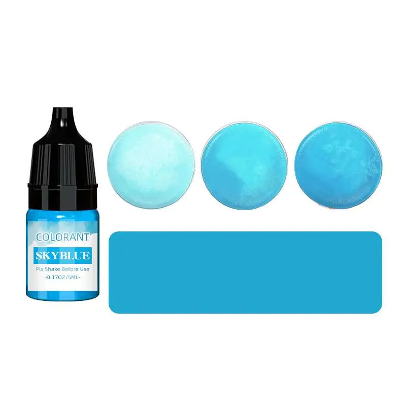 A bottle of SkyBlue liquid colorant with three round discs of varying shades of light blue.
