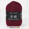 A skein of dark maroon milk cotton yarn labeled with Chinese characters and a YIMIAN size tag.