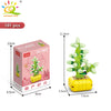 A set of 101 plastic flower succulent building blocks in various shades of green and yellow.