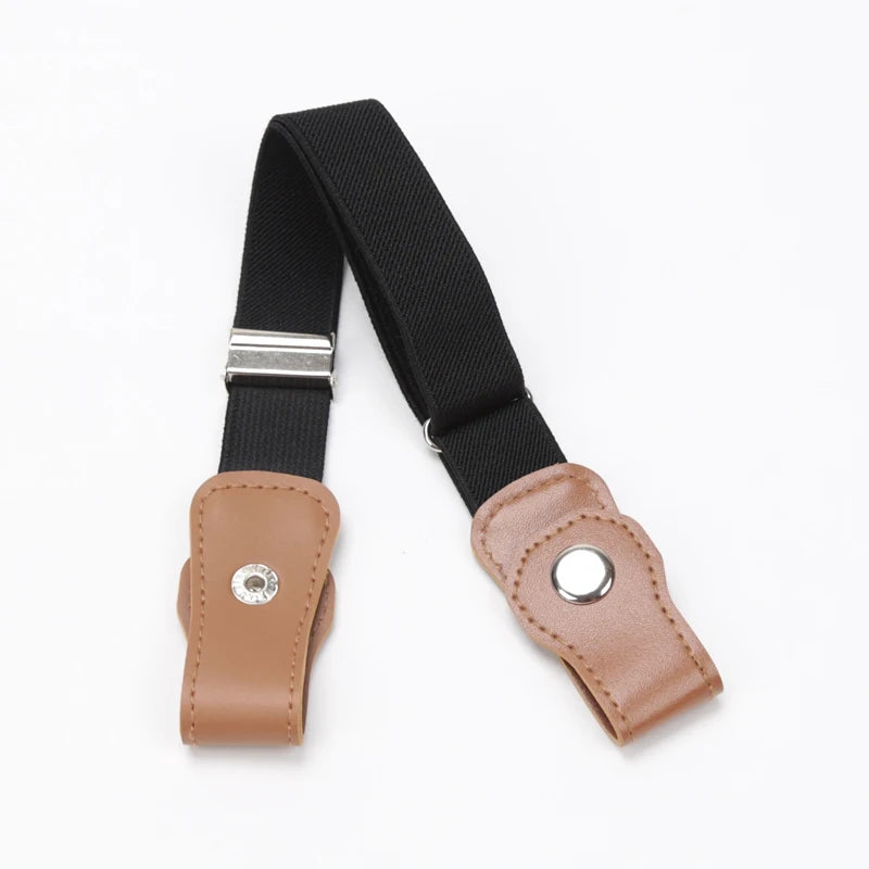 A black canvas belt with a silver buckle and a tan leather-look finish.