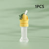 A clear plastic straw and bottle cap converter with a green and yellow design for children.