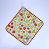 A square felted fabric item featuring a pattern of red strawberries and green leaves on a white background.