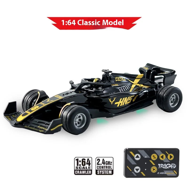 A black 1:64 scale RC drift car model with yellow accents and a transparent battery pack.