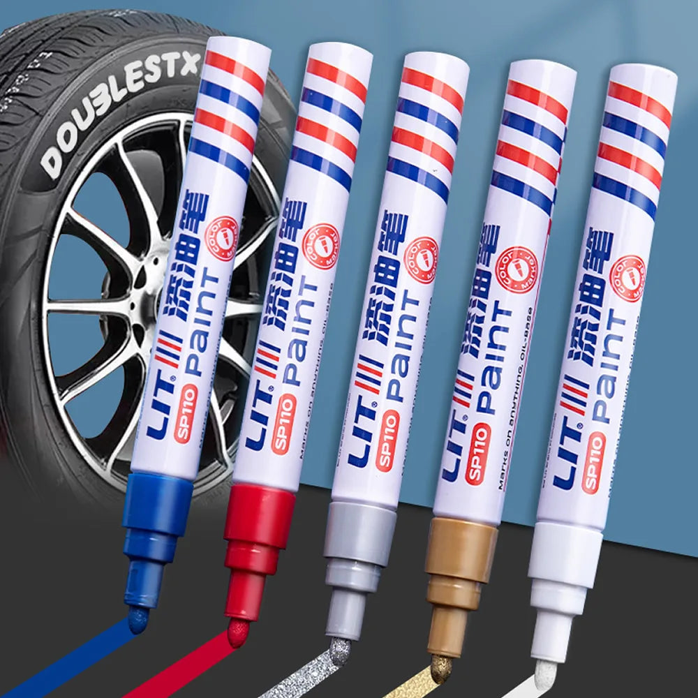 Eight permanent paint markers in various colors and tips are shown next to a tire.