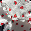 White long-sleeve shirt for a baby girl with a red strawberry print