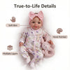 A realistic 18-inch reborn baby doll with soft skin, multiple layers, and hand-painted details.
