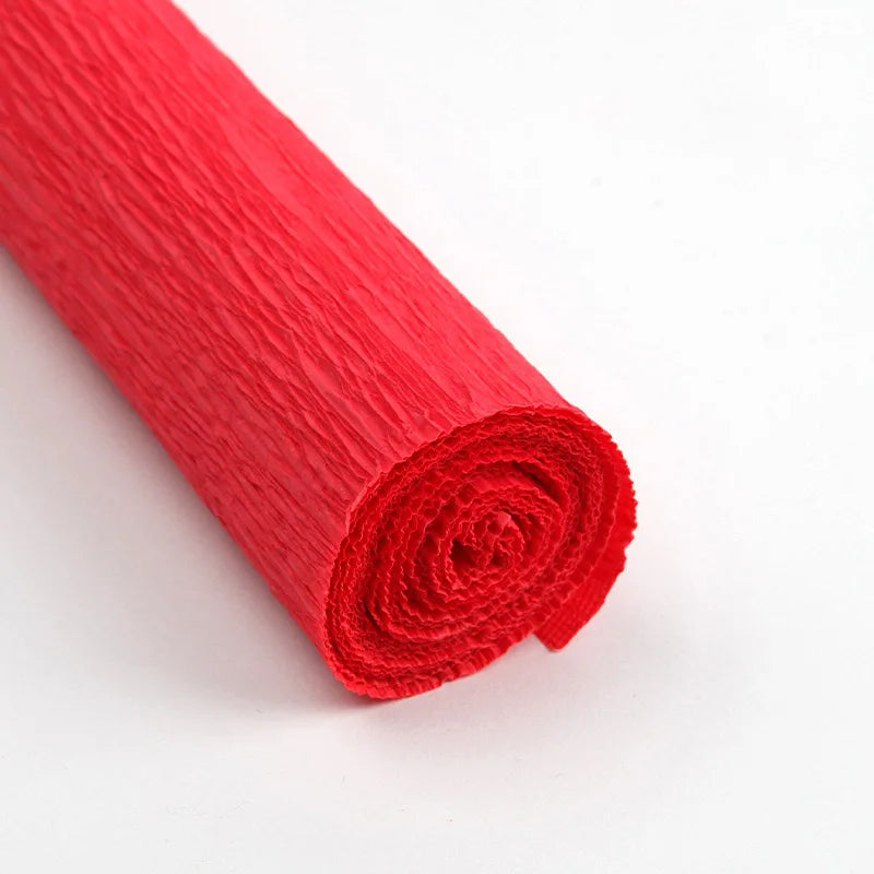 A roll of bright red crepe paper for DIY crafts and gift wrapping.