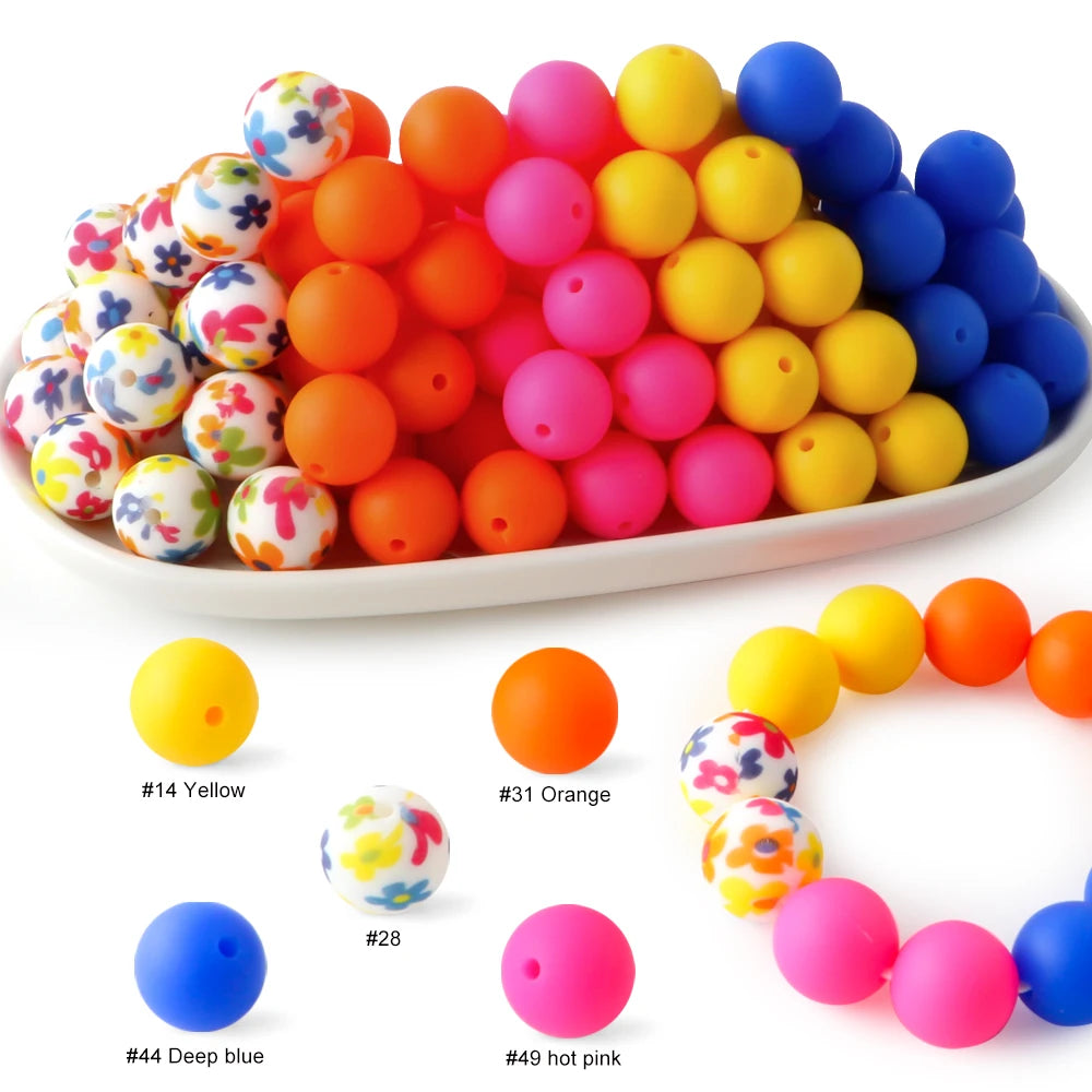 A collection of colorful silicone beads in various shades including yellow, orange, pink, and blue.