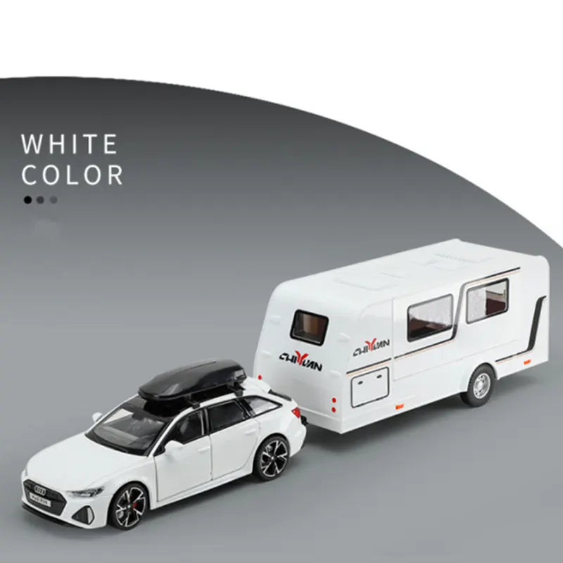 White diecast metal RV camper truck model shown in a side view against a gray background.