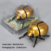 A set of wind-up insect toys including a ladybug, bee, and beetle packaged in clear plastic.