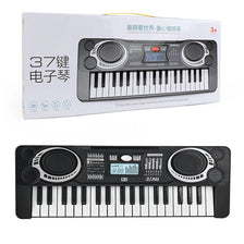 A black 37-key electronic keyboard is shown with its packaging box.