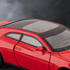 A red Dodge Challenger SRT Hellcat diecast model car with a black glass roof, shown in a studio setting.