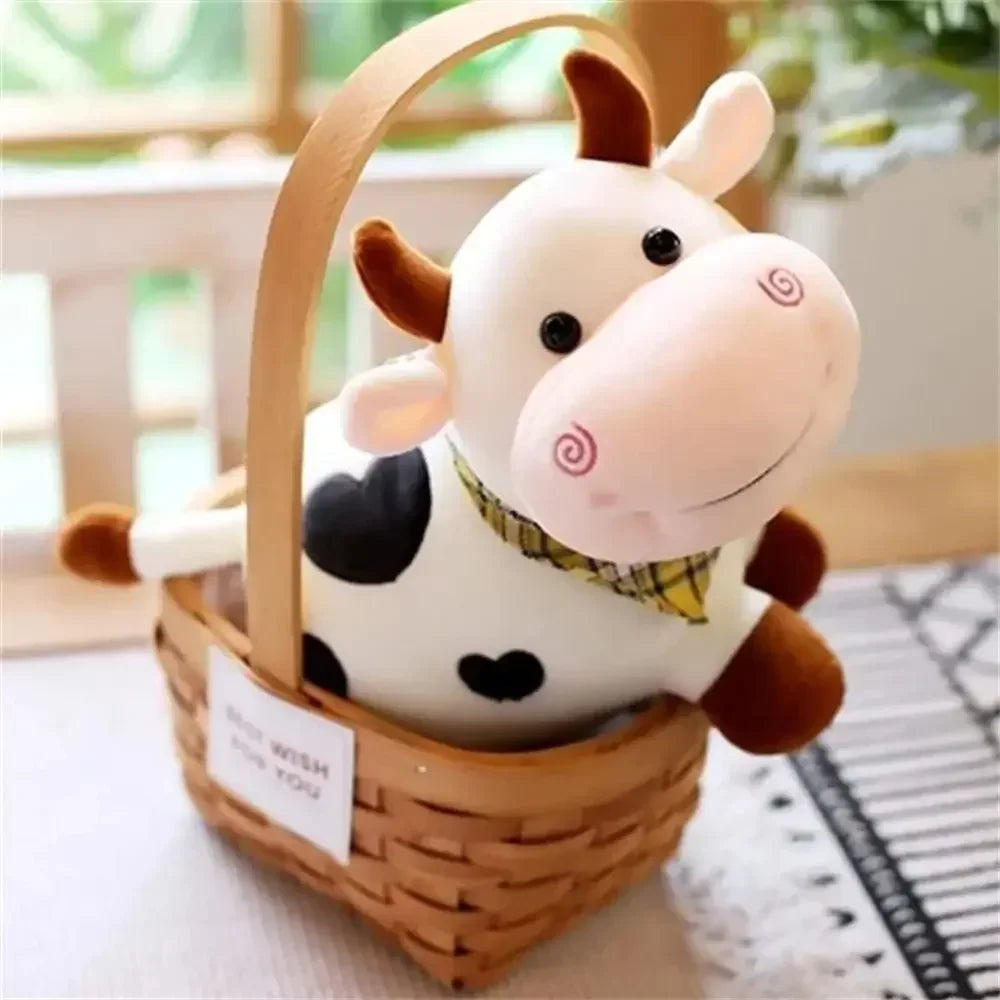 A white and black cow plush toy with brown accents is displayed in a woven basket.
