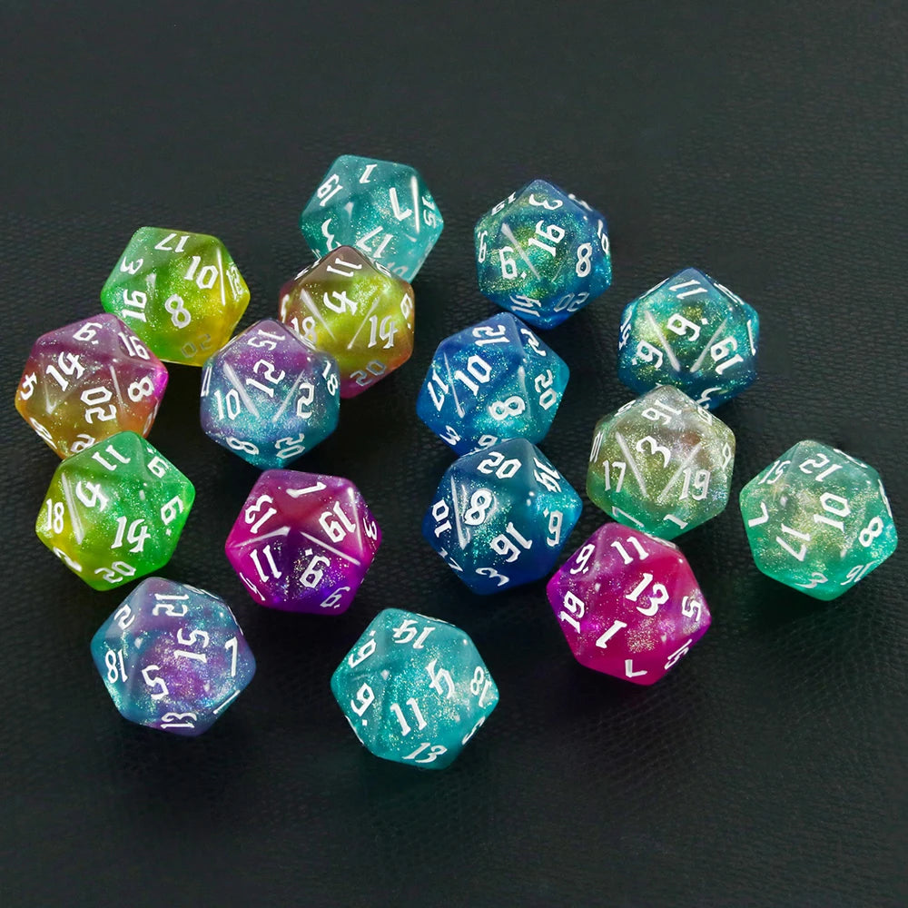 A collection of ten glitter polyhedral dice in various shades of blue, green, and purple scattered on a dark surface.