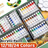A collection of acrylic paint tubes in various colors and shades displayed in an open set with accompanying instructions.