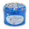 A jar of blue slime putty with fruit slices on top and a small animal figure.