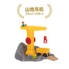 A yellow wooden train track accessory set featuring an airport and gas station scene on a gray landscape.