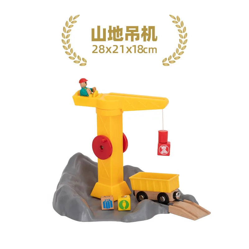 A yellow wooden train track accessory set featuring an airport and gas station scene on a gray landscape.