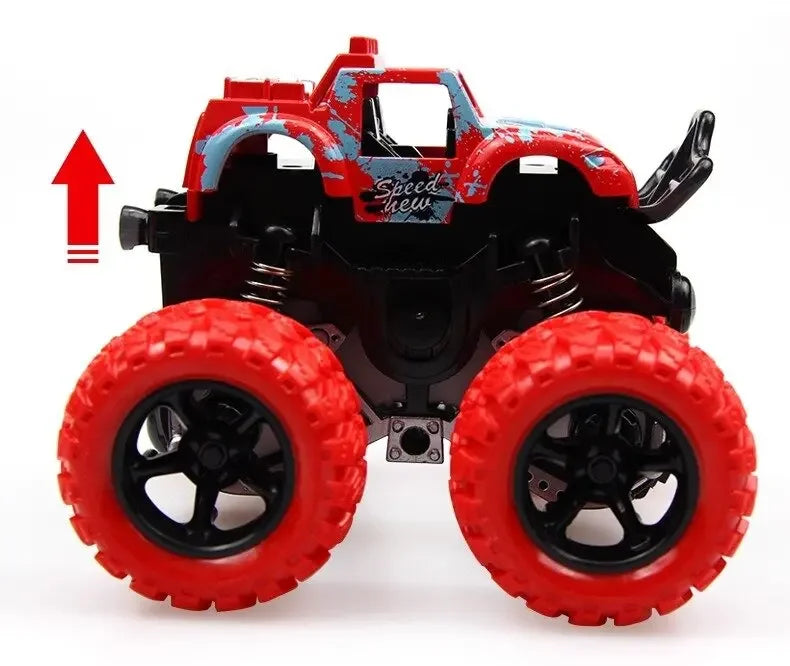 A red and black friction-powered monster truck toy with large tires is shown from above.