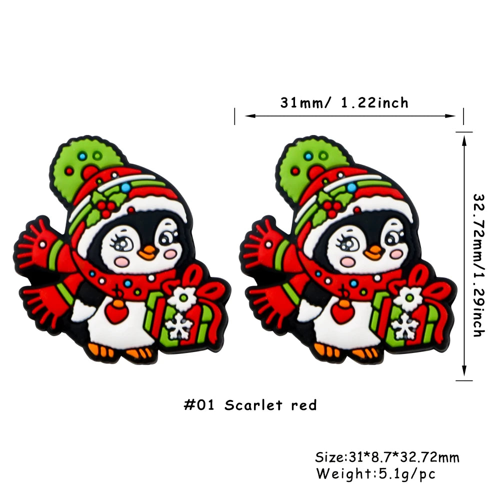 Scarlet red silicone bead shaped like a penguin with festive Christmas decorations