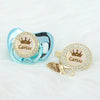 Personalized rose gold crown pacifier and clip set with a sparkling medallion
