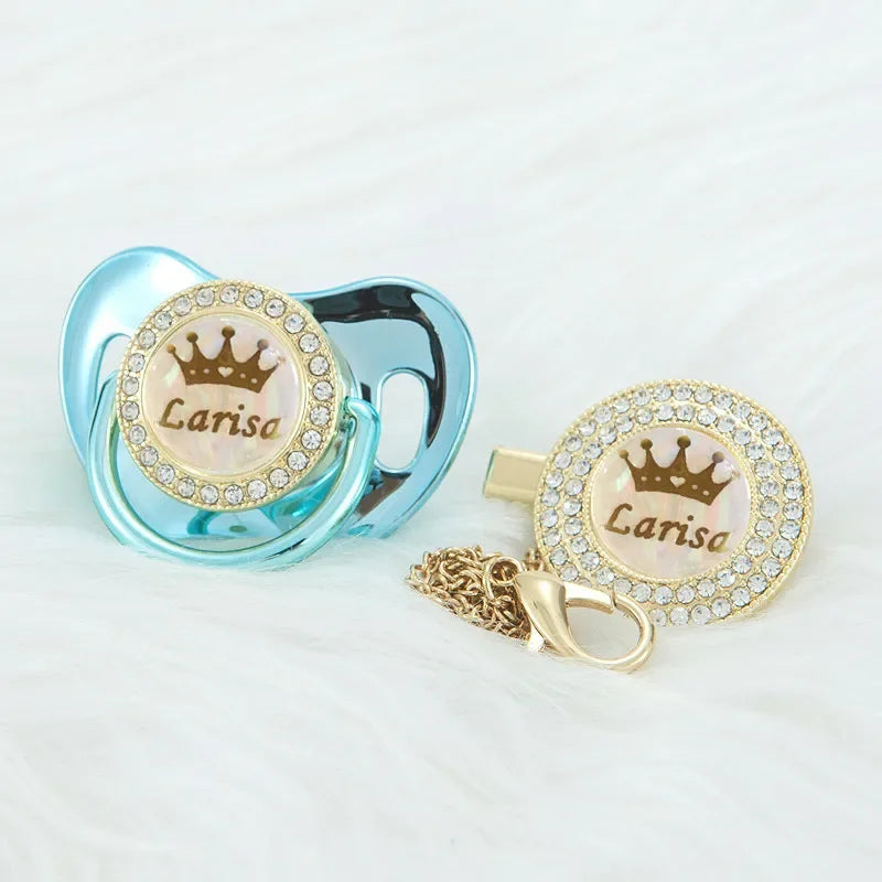 Personalized rose gold crown pacifier and clip set with a sparkling medallion