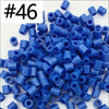 A pile of 1000 small blue and purple fuse beads for creative craft projects.