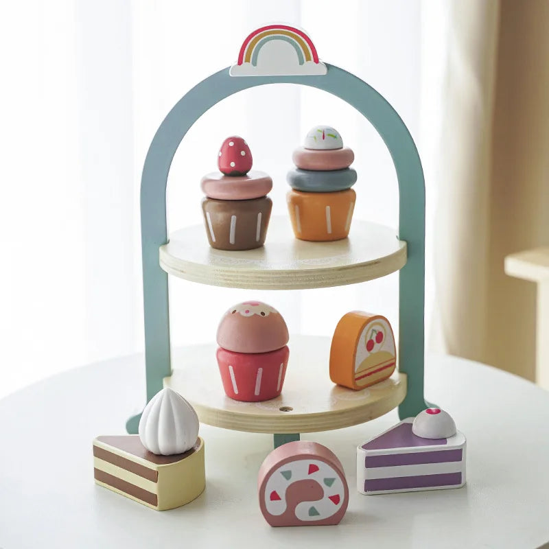 A wooden pretend play tea party set featuring colorful stacked cups and a rainbow arch display.