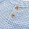 Light blue knitted cotton baby bodysuit with a collar and wooden buttons