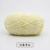 A ball of pale yellow pre-dyed milk cotton yarn used for knitting and crochet.