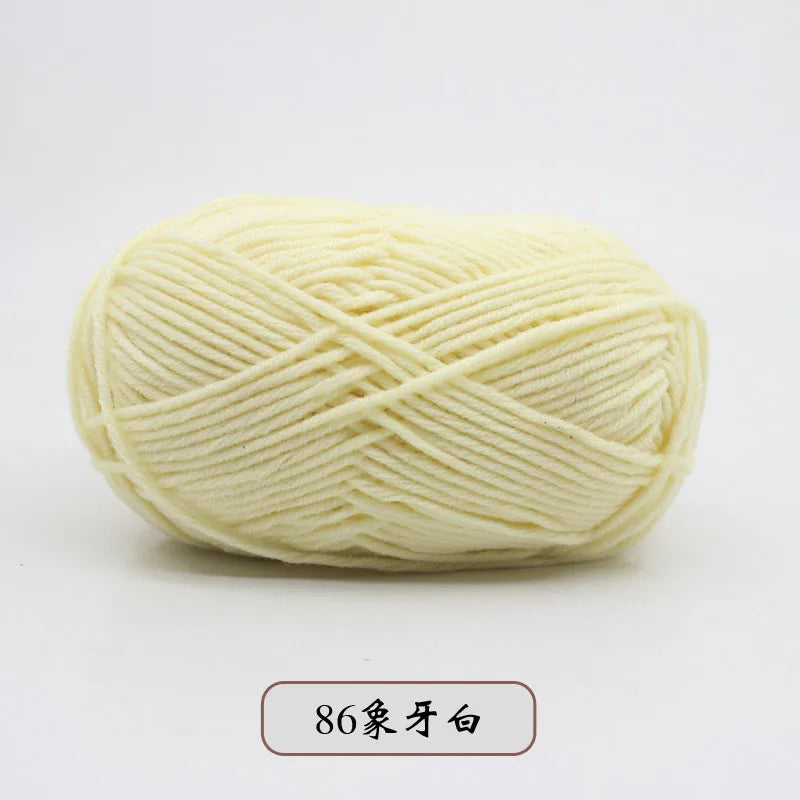 A ball of pale yellow pre-dyed milk cotton yarn used for knitting and crochet.