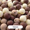 A close-up view of various pastel bear-shaped acrylic craft beads in shades of brown and cream.