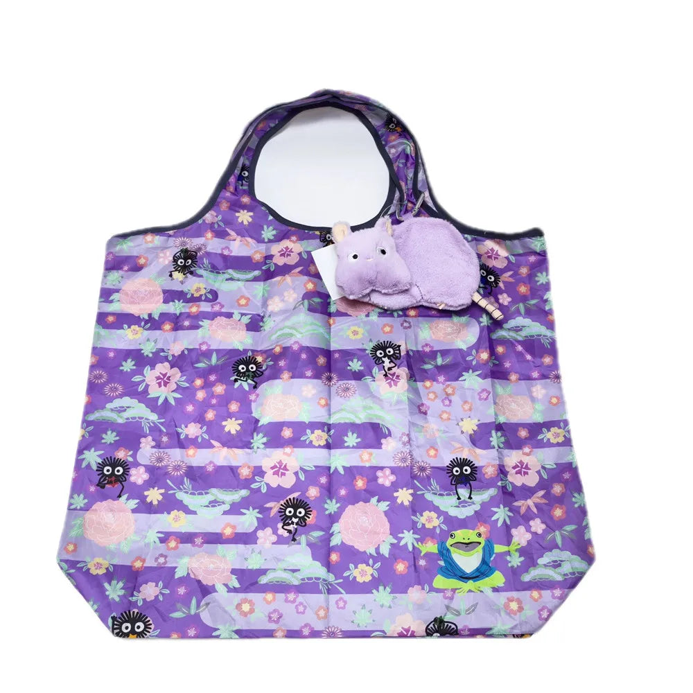 A purple fabric pouch with a purple and pink floral pattern featuring small animal plush toys.