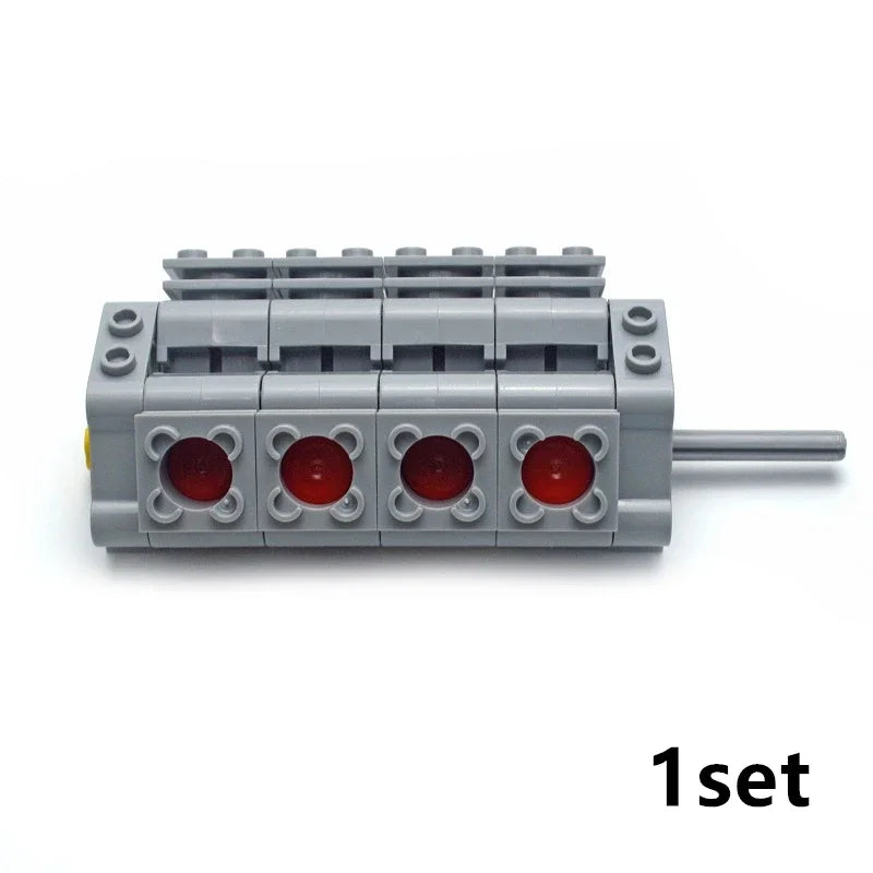 A gray motor and servo set for building blocks with a metal shaft.