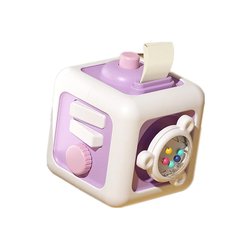 A white and purple 6-in-1 Montessori activity cube for toddlers with various sensory features.