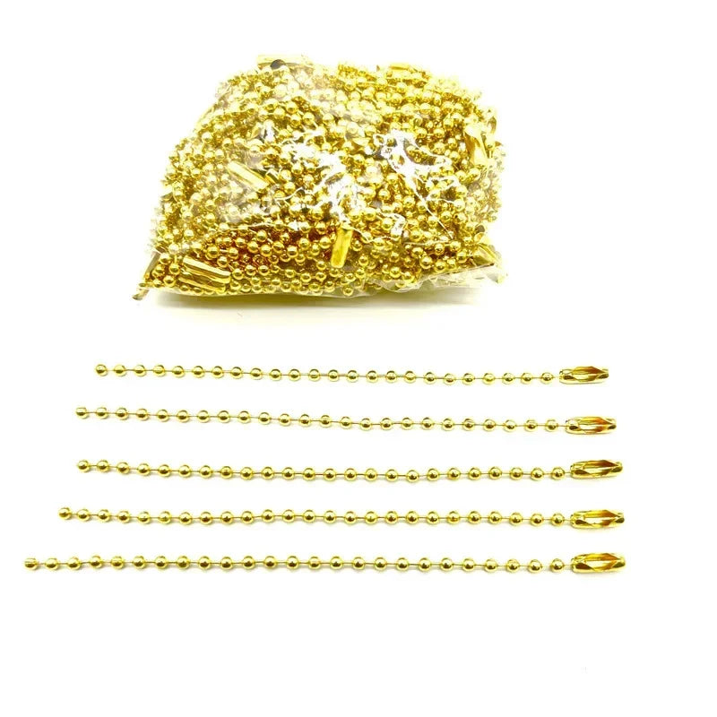 A pile of gold ball bead chains for DIY jewelry and keychains.