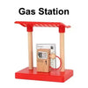 A red gas station model featuring a wooden pump and track for creative railway play.