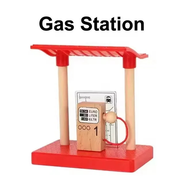 A red gas station model featuring a wooden pump and track for creative railway play.