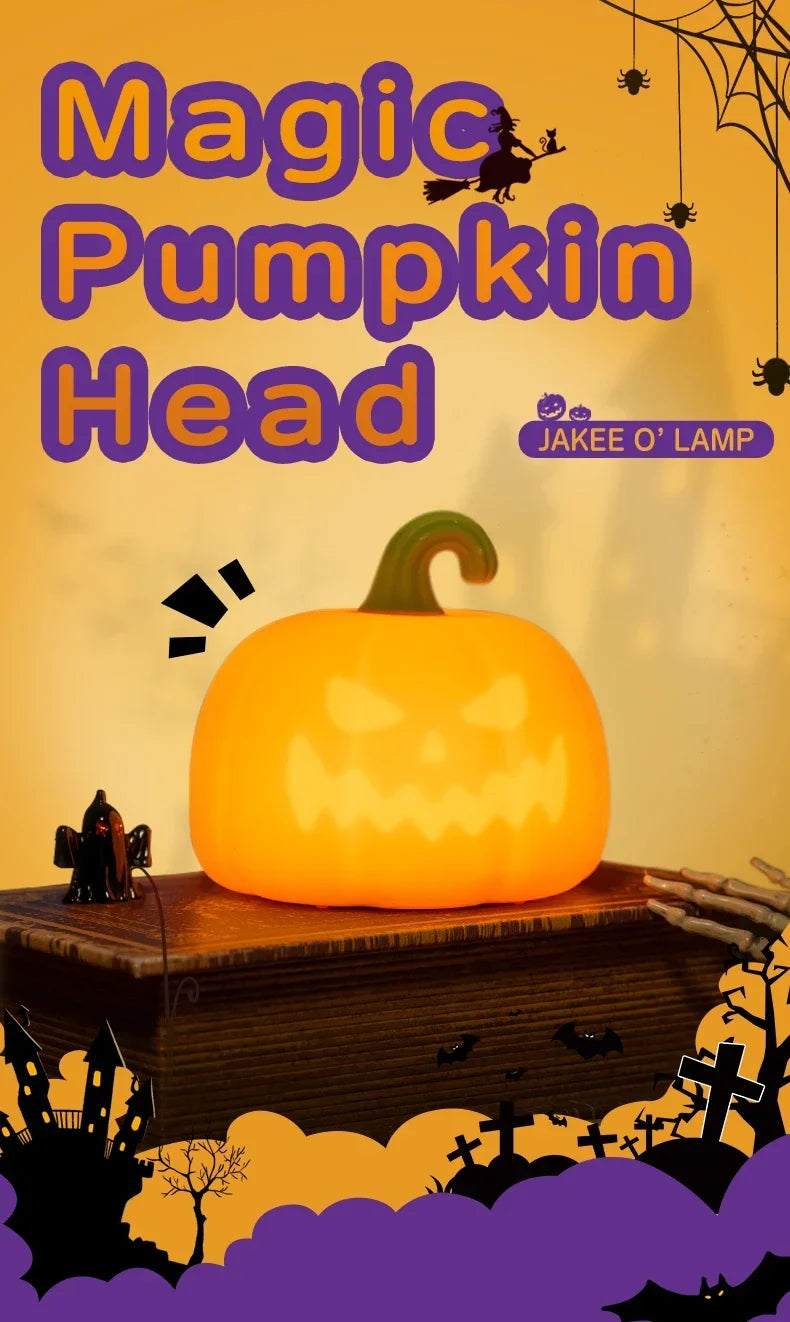 A glowing orange pumpkin head night light sits on a wooden surface with dark silhouettes of bats and trees in the background.