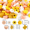 A collection of silicone flower and leaf beads in various colors including yellow, pink, white, and orange.
