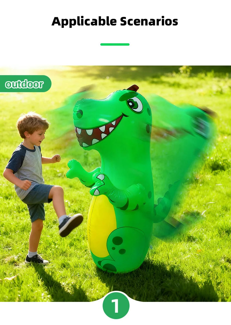 A green inflatable dinosaur punching bag is shown outdoors with a young boy playing nearby.