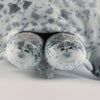A plush seal family pillow featuring a large adult seal and four small baby seals.