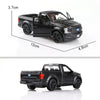 A black Ford F150 SVT Raptor 1:36 diecast model truck shown from the side.